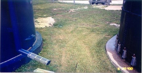 June 20, 2000 Looking from the North, more than 2 1/2 years later. The bolted tank on the right is wet with sweat. The welded tank on the left is dry.