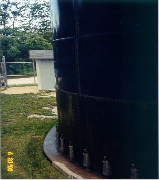 JUNE 20, 2000 The bolted tank is wet with sweat and covered with mold.
