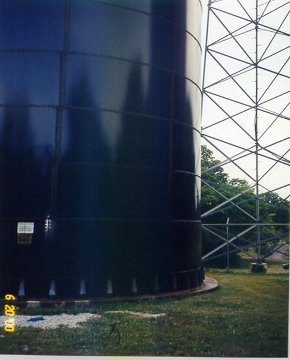 JUNE 20, 2000 Looking from the South. The bolted tank has heavy mold growth up 12 to 15 feet. The sweat line is visible on this picture.